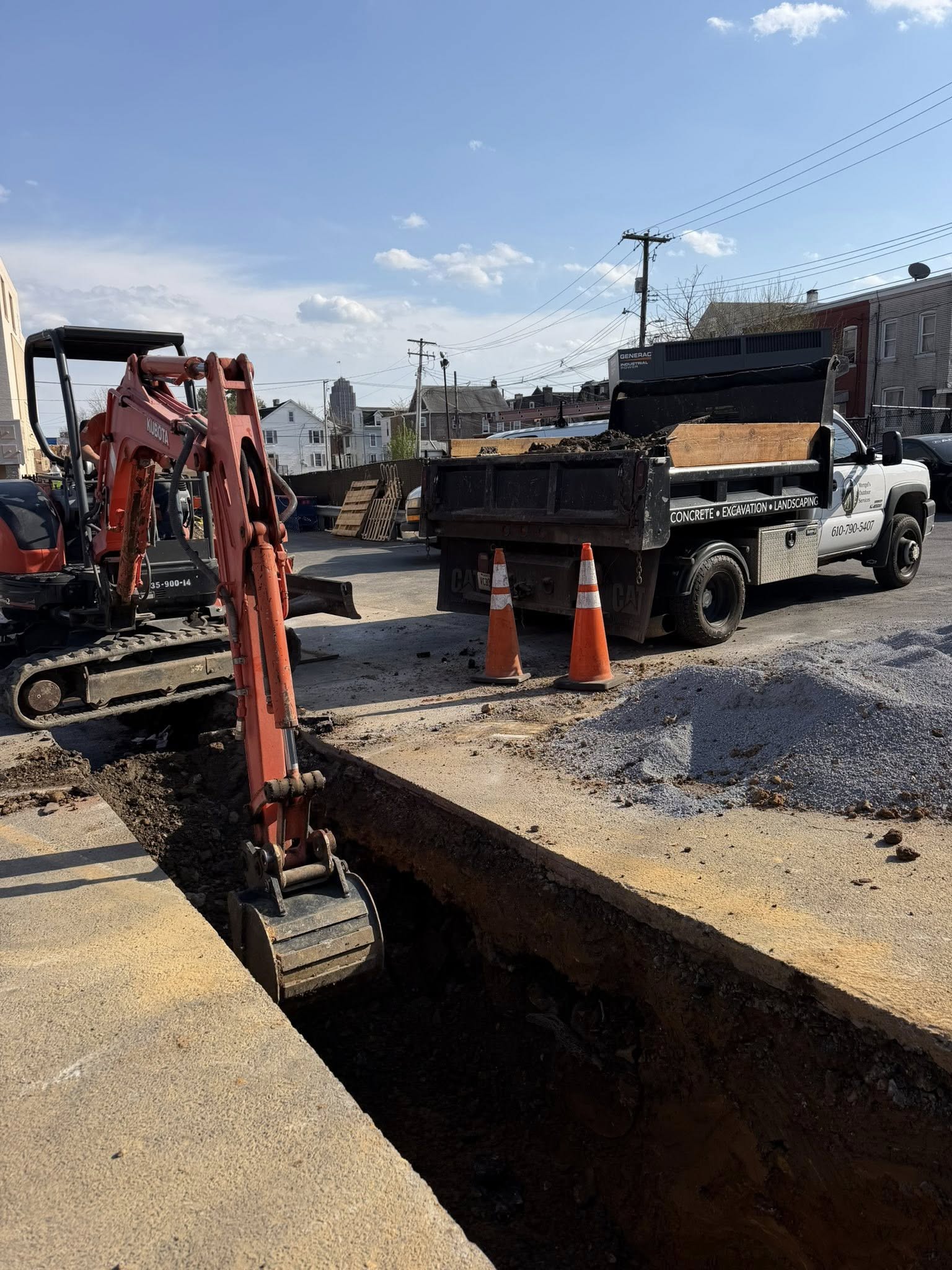 mengels outdoor services excavating under a driveway