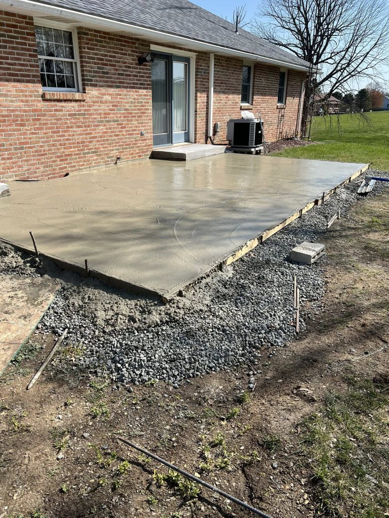 pouring concrete for a back door patio