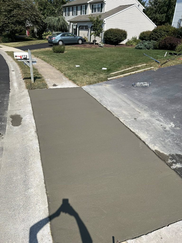pouring concrete to replace an old sidewalk
