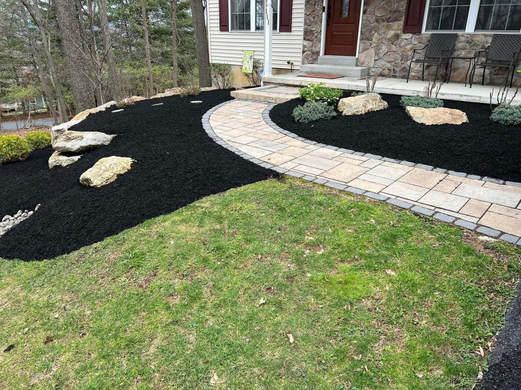 refreshed landscaping, front garden bed mulching