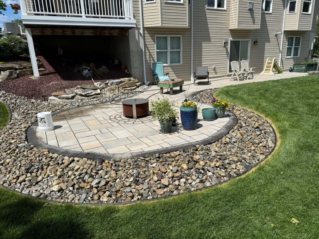 trimmed stone garden beds around patio