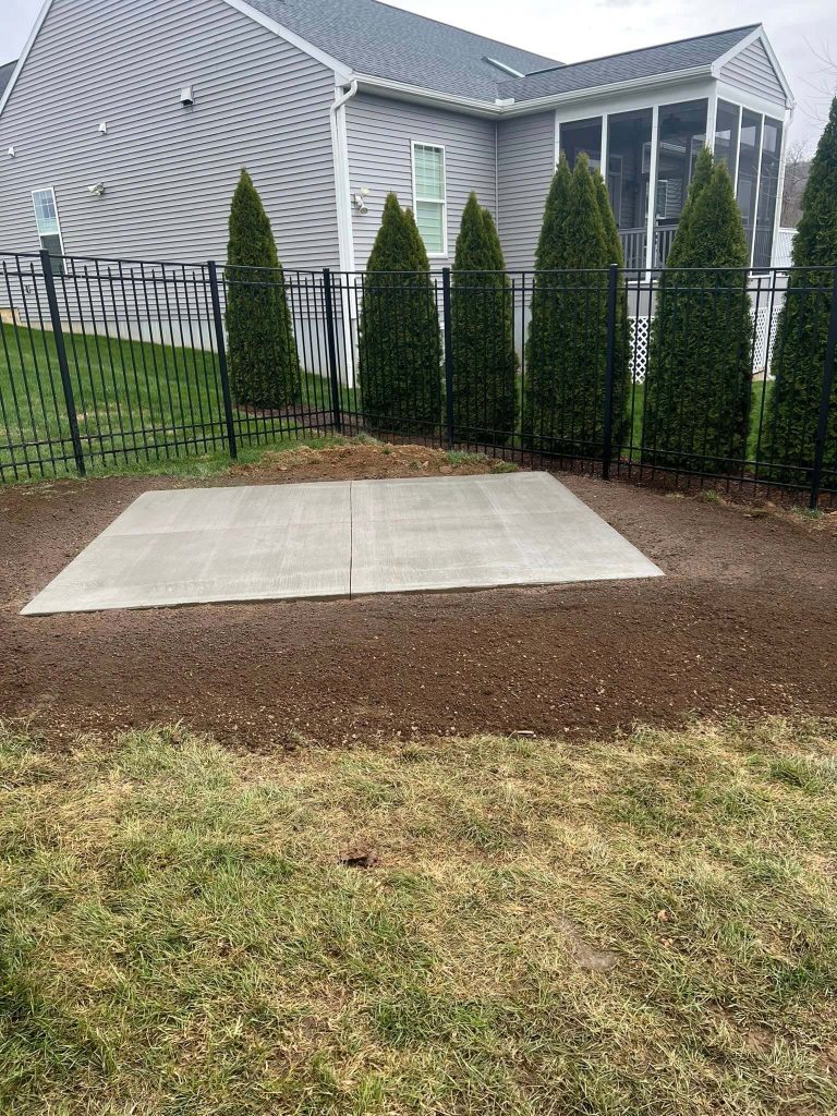 new concrete patio and regraded lawn