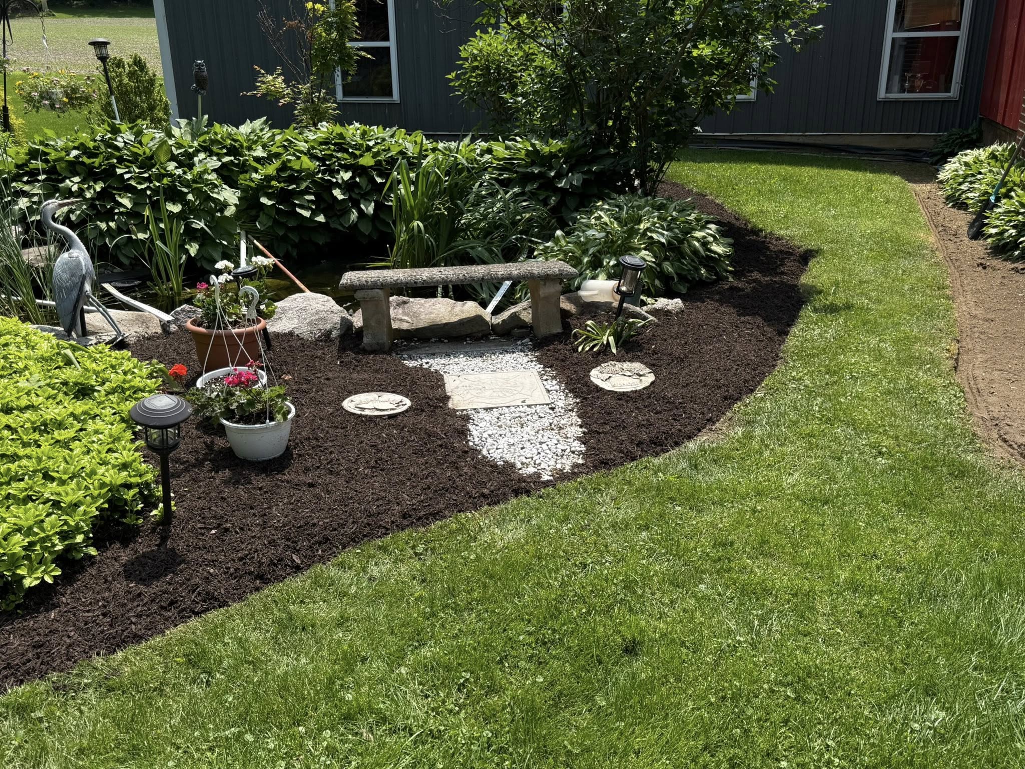 spring cleanup landscaping project of garden beds